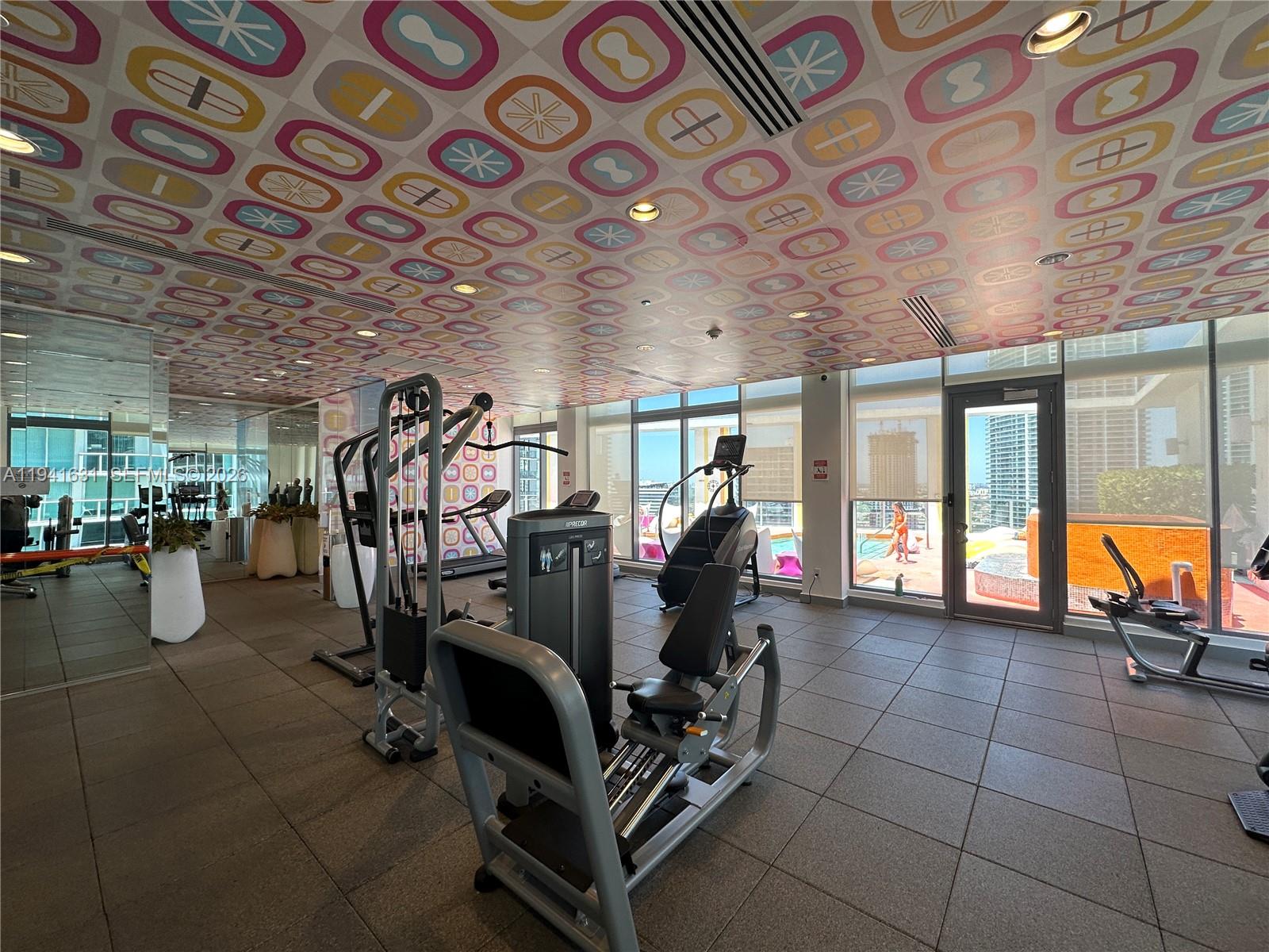 31 Southeast 6th Street, Unit 2007 Miami, FL 33131 - Photo 17 of 22 a view of a room with gym equipment