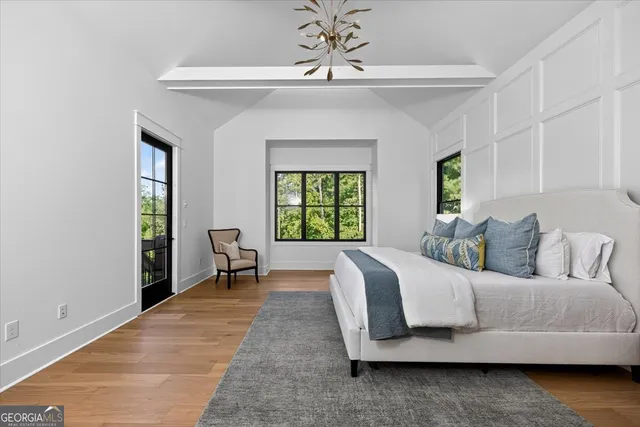 a living room with a bed furniture and a window
