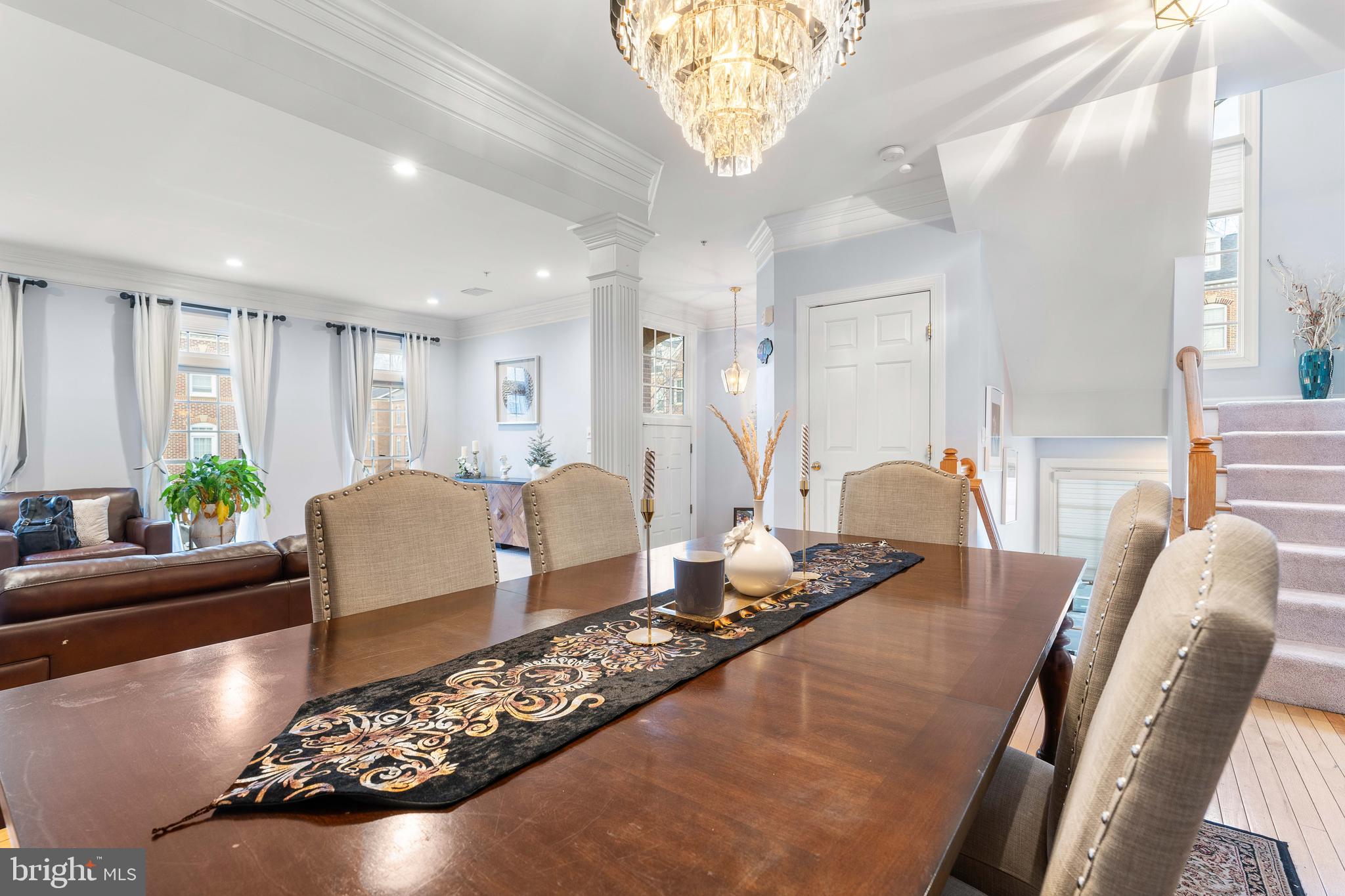 12461 Rose Path Circle Fairfax, VA 22033 - Photo 11 of 43 a living room with furniture rug and a chandelier