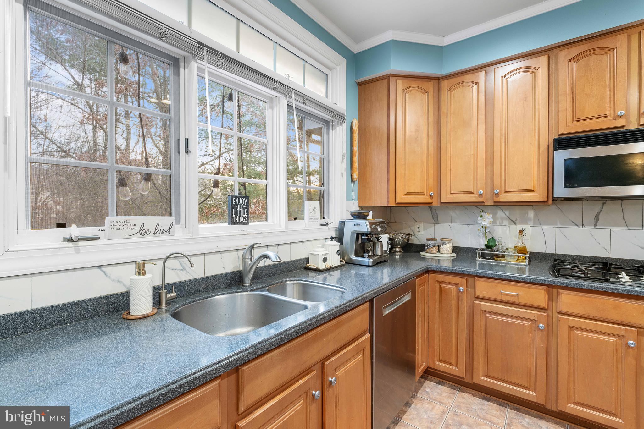 12461 Rose Path Circle Fairfax, VA 22033 - Photo 12 of 43 a kitchen with stainless steel appliances granite countertop a sink a stove and cabinets