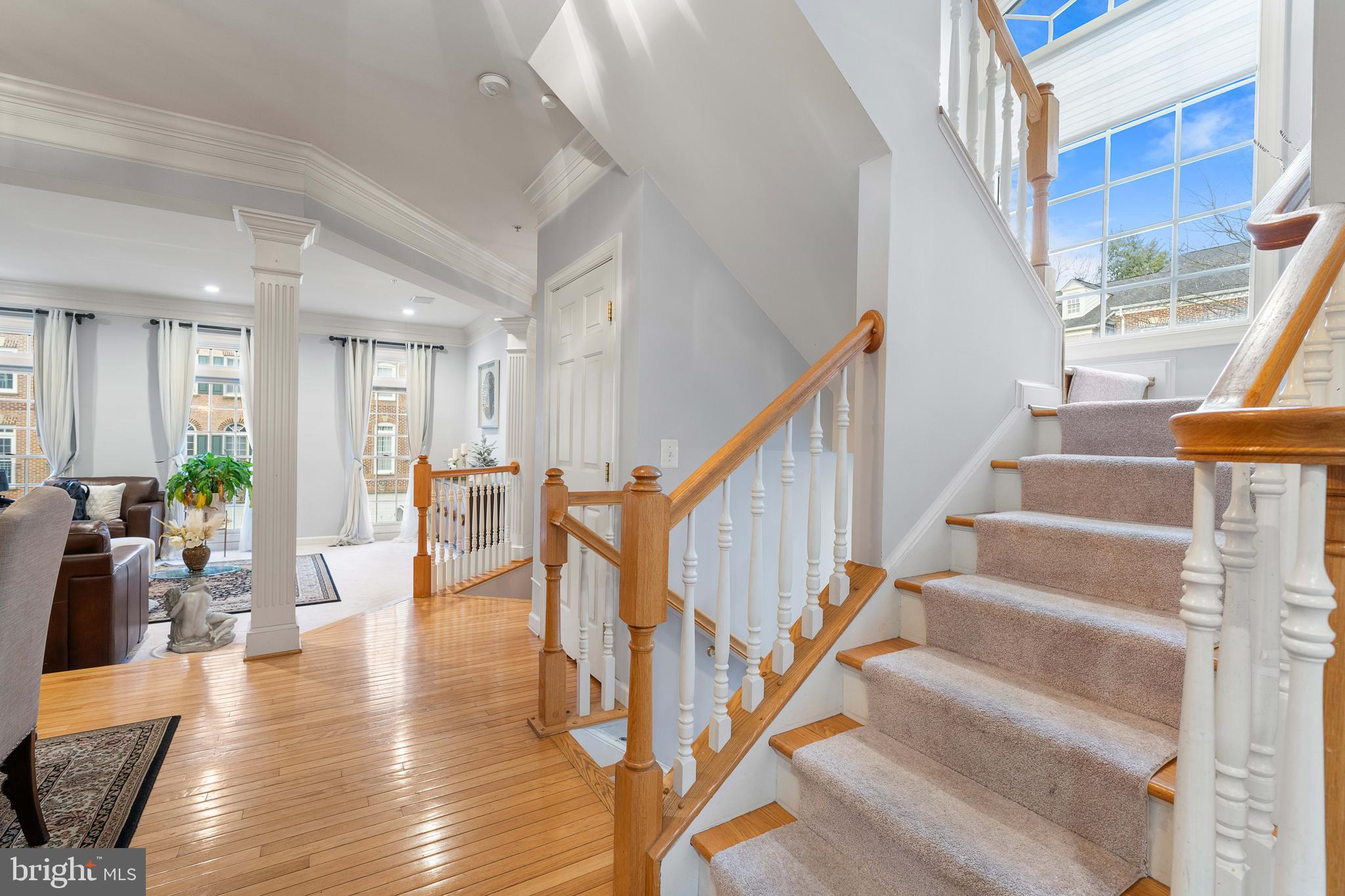 12461 Rose Path Circle Fairfax, VA 22033 - Photo 18 of 43 a view of entryway and hall with wooden floor