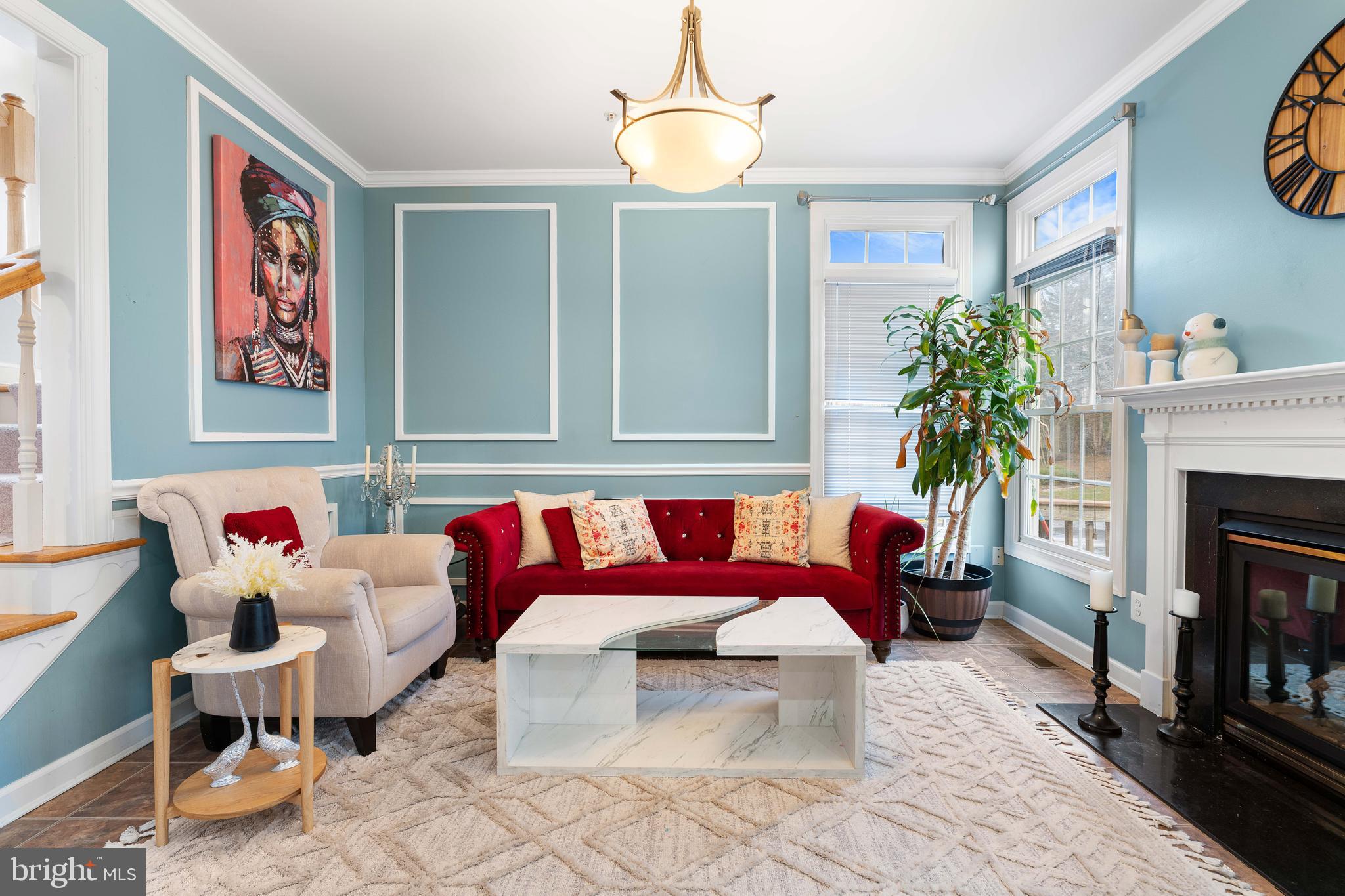 12461 Rose Path Circle Fairfax, VA 22033 - Photo 19 of 43 a living room with furniture and a fireplace