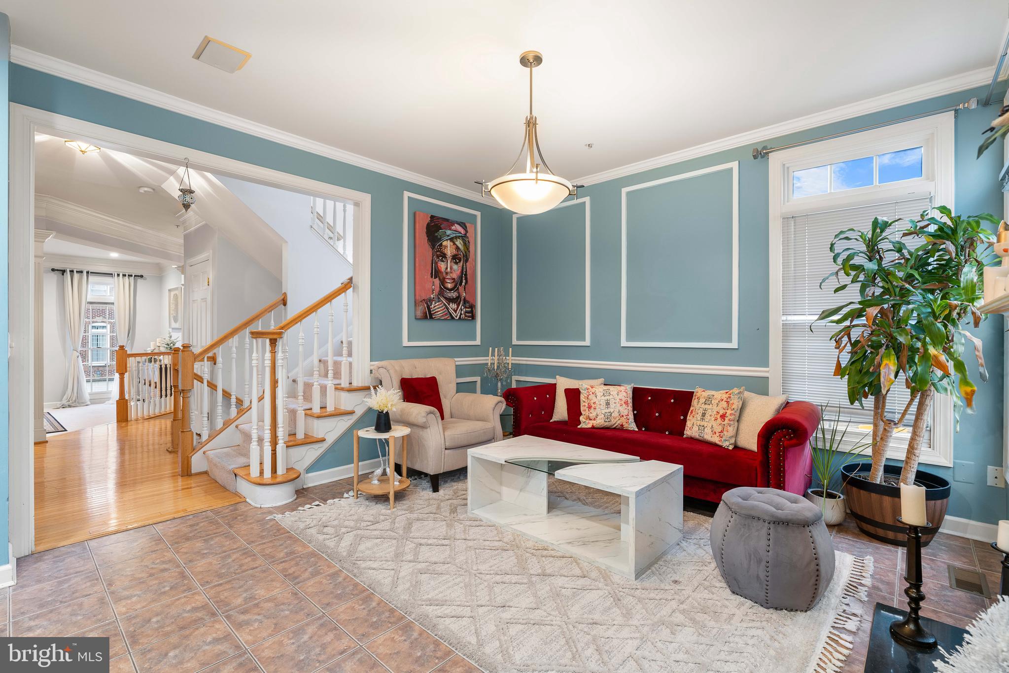12461 Rose Path Circle Fairfax, VA 22033 - Photo 20 of 43 a living room with furniture and a chandelier