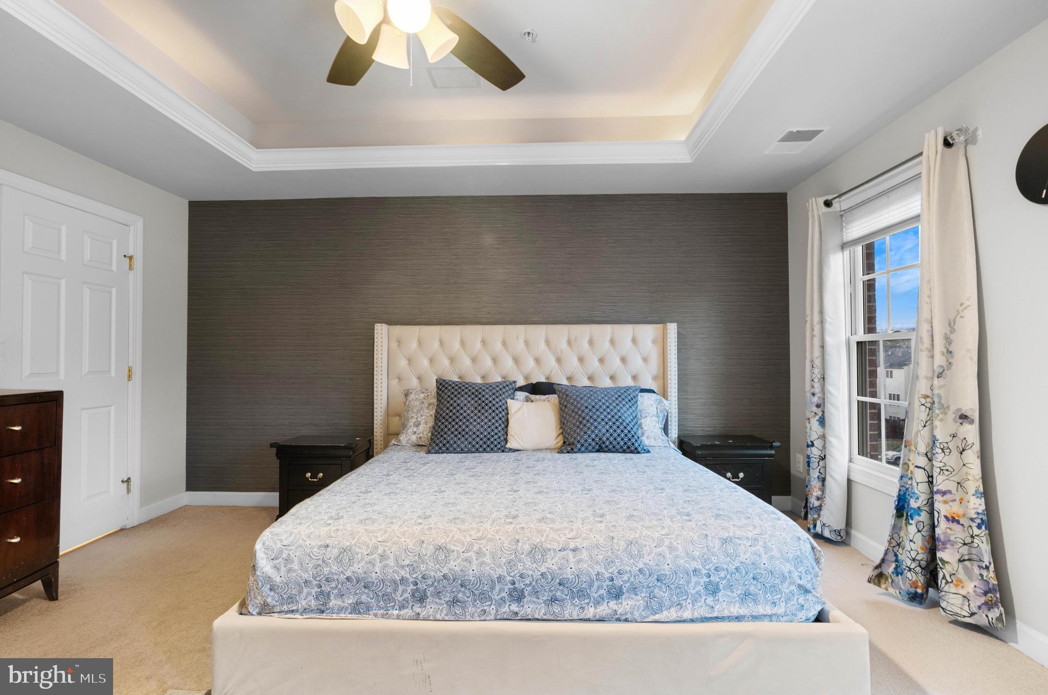 12461 Rose Path Circle Fairfax, VA 22033 - Photo 22 of 43 a bedroom with a large bed and a tv on table