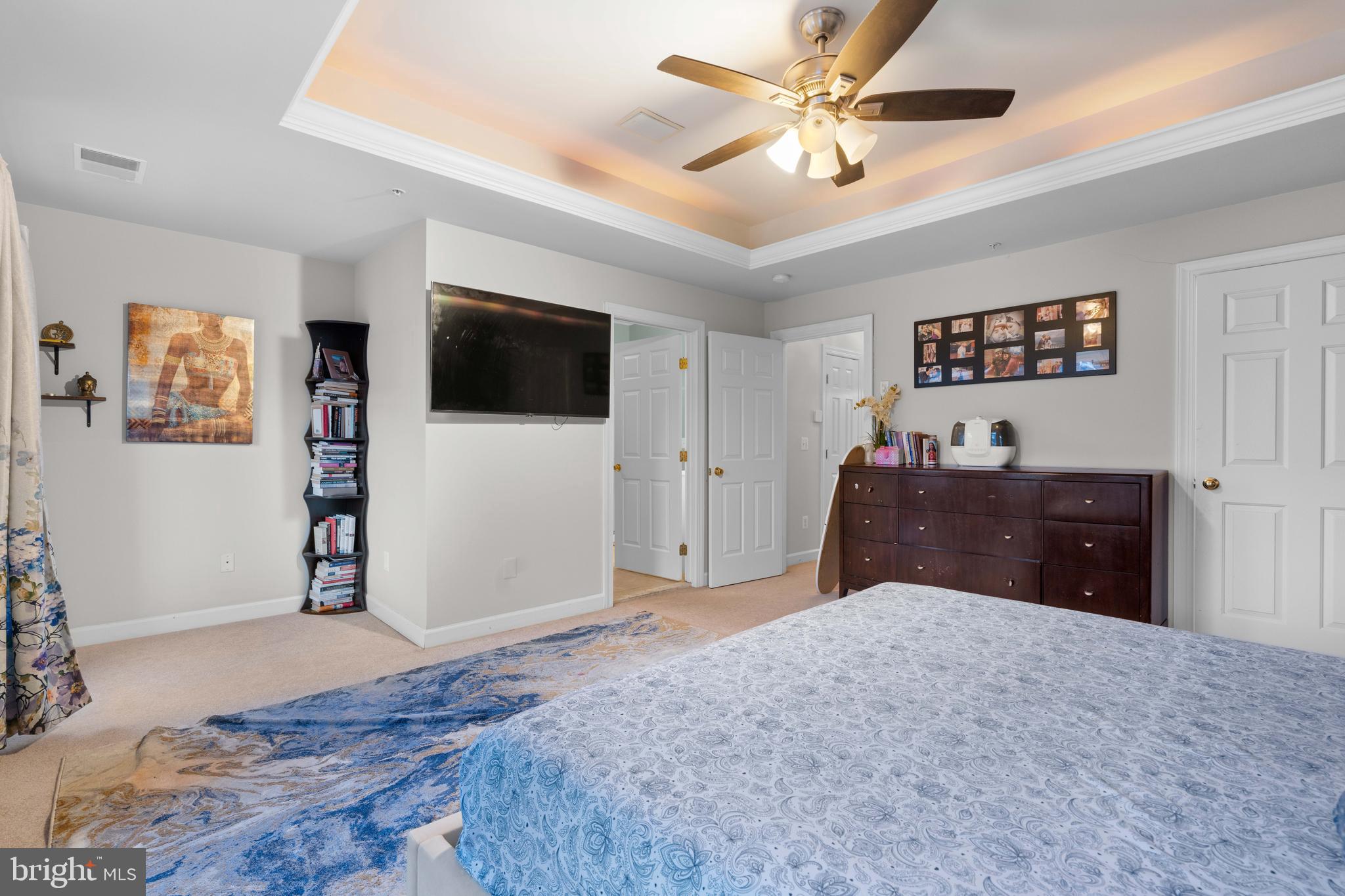12461 Rose Path Circle Fairfax, VA 22033 - Photo 25 of 43 a bedroom with a bed and a flat screen tv