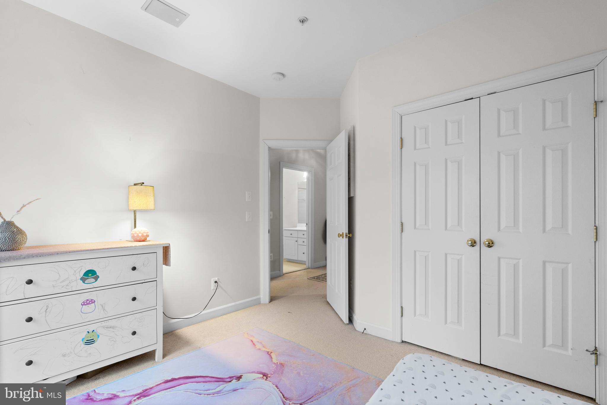 12461 Rose Path Circle Fairfax, VA 22033 - Photo 27 of 43 a bedroom with a bed and a dresser