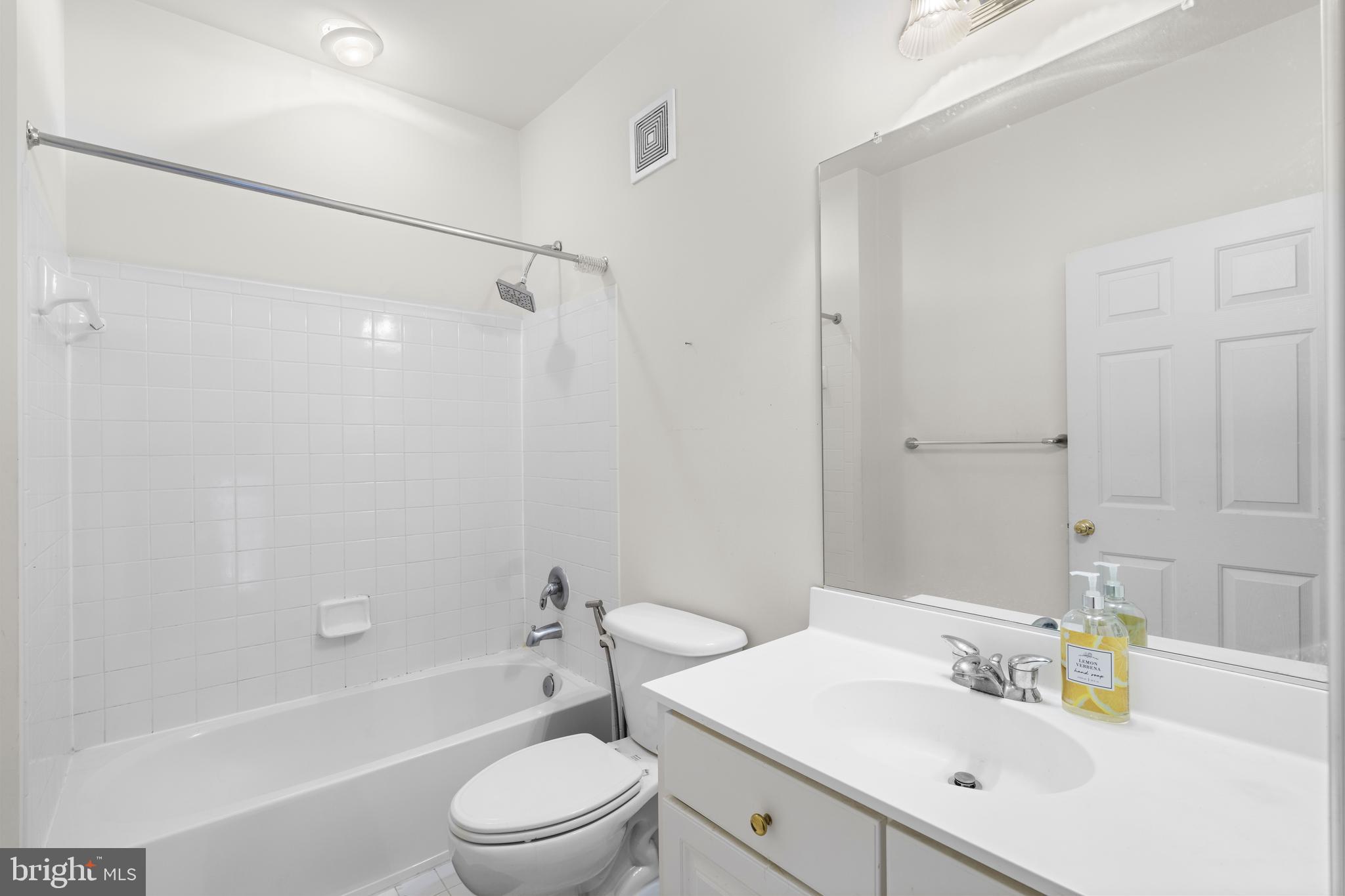 12461 Rose Path Circle Fairfax, VA 22033 - Photo 30 of 43 a bathroom with a sink toilet vanity and shower