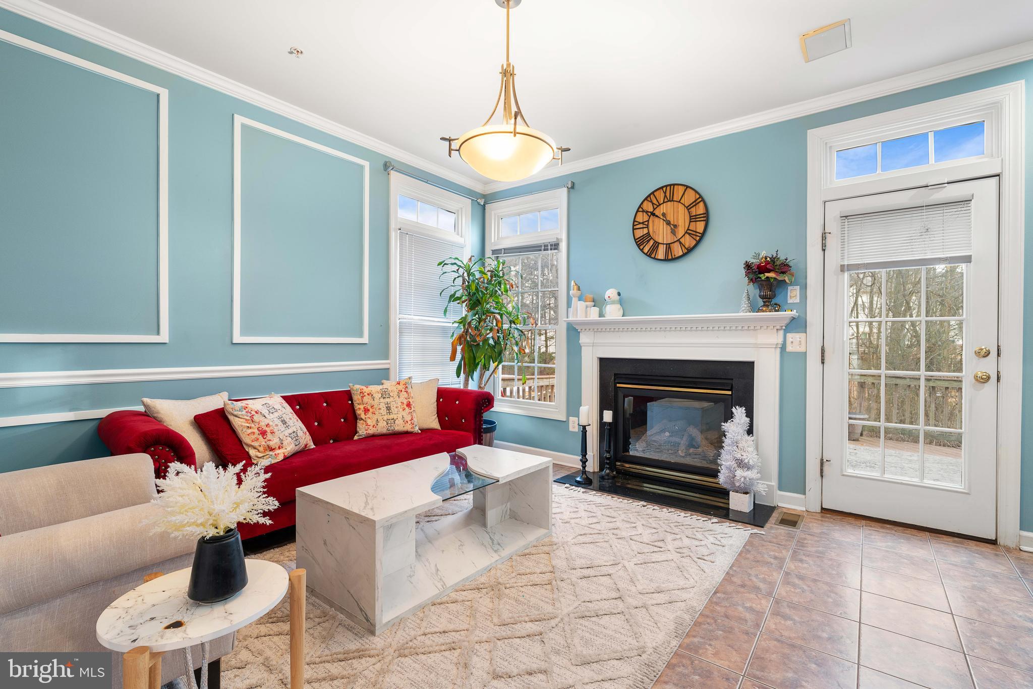 12461 Rose Path Circle Fairfax, VA 22033 - Photo 4 of 43 a living room with a couch and a fireplace