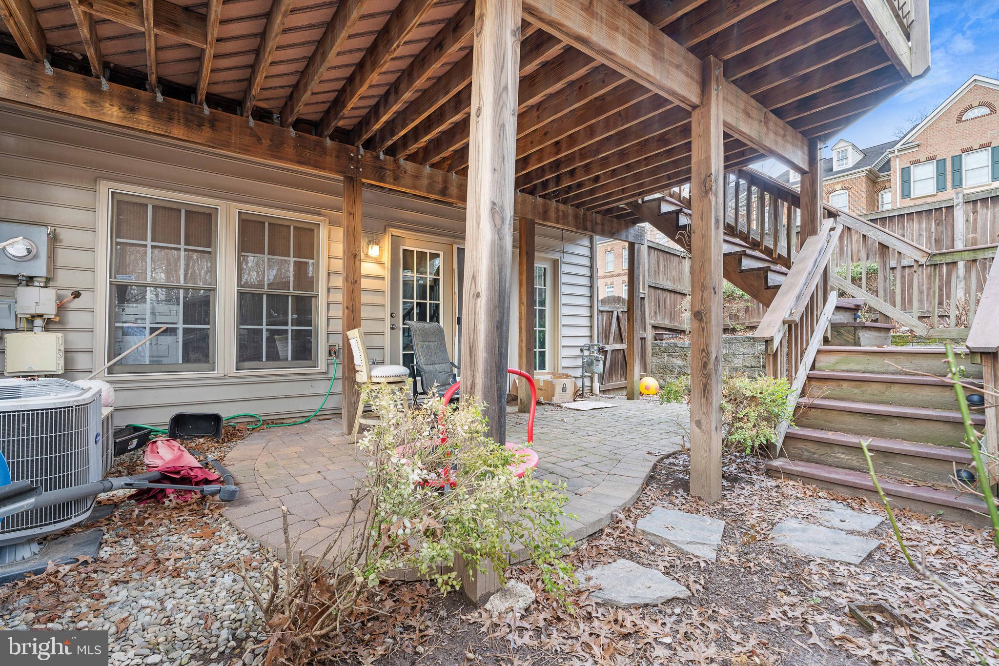 12461 Rose Path Circle Fairfax, VA 22033 - Photo 41 of 43 a view of a porch with a table and chairs