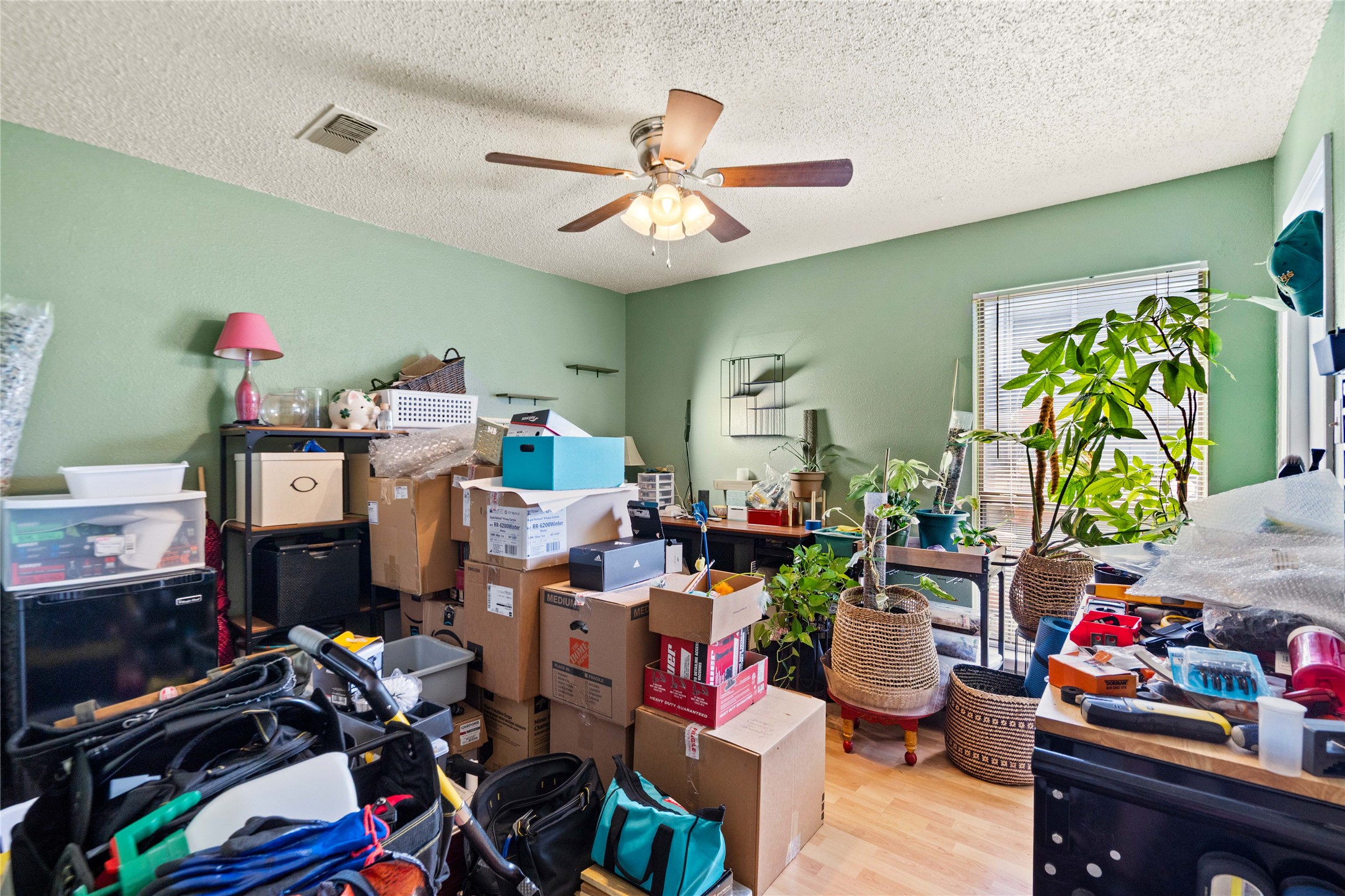 2018 West Rundberg Lane, Unit 4B Austin, TX 78758 - Photo 13 of 28 a work room with furniture and a potted plant