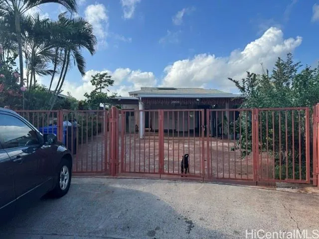 a view of a house with a backyard