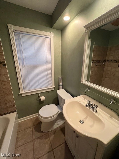 1260 Argonne Road Cleveland, OH 44121 - Photo 28 of 50 Full bathroom with vanity, tiled shower / bath combo, toilet, and tile patterned flooring