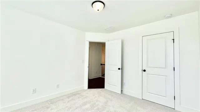 a view of a bedroom with closet area
