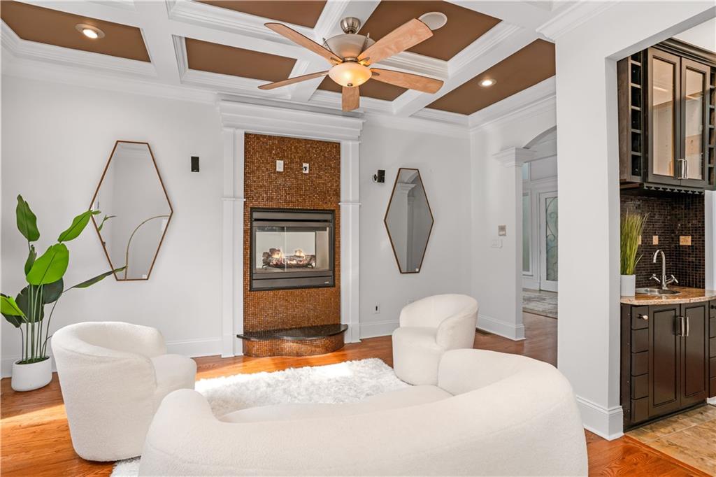 105 Ensley Point Fayetteville, GA 30214 - Photo 18 of 37 a bedroom with a bed a clock on the wall and dresser