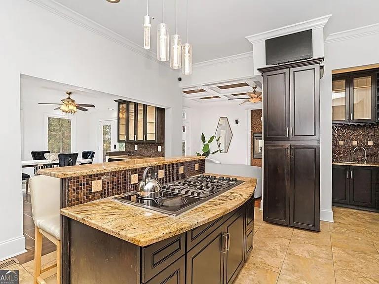 105 Ensley Point Fayetteville, GA 30214 - Photo 19 of 37 a kitchen with stainless steel appliances granite countertop a sink stove and refrigerator