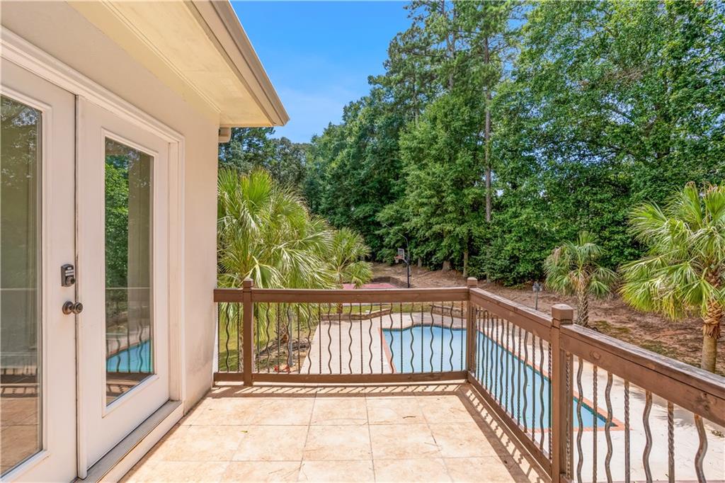 105 Ensley Point Fayetteville, GA 30214 - Photo 22 of 37 a view of a balcony with trees