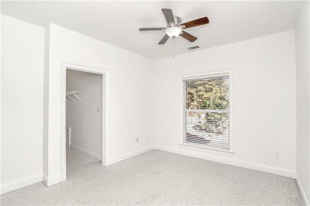 105 Ensley Point Fayetteville, GA 30214 - Photo 25 of 37 an empty room with a window and a ceiling fan