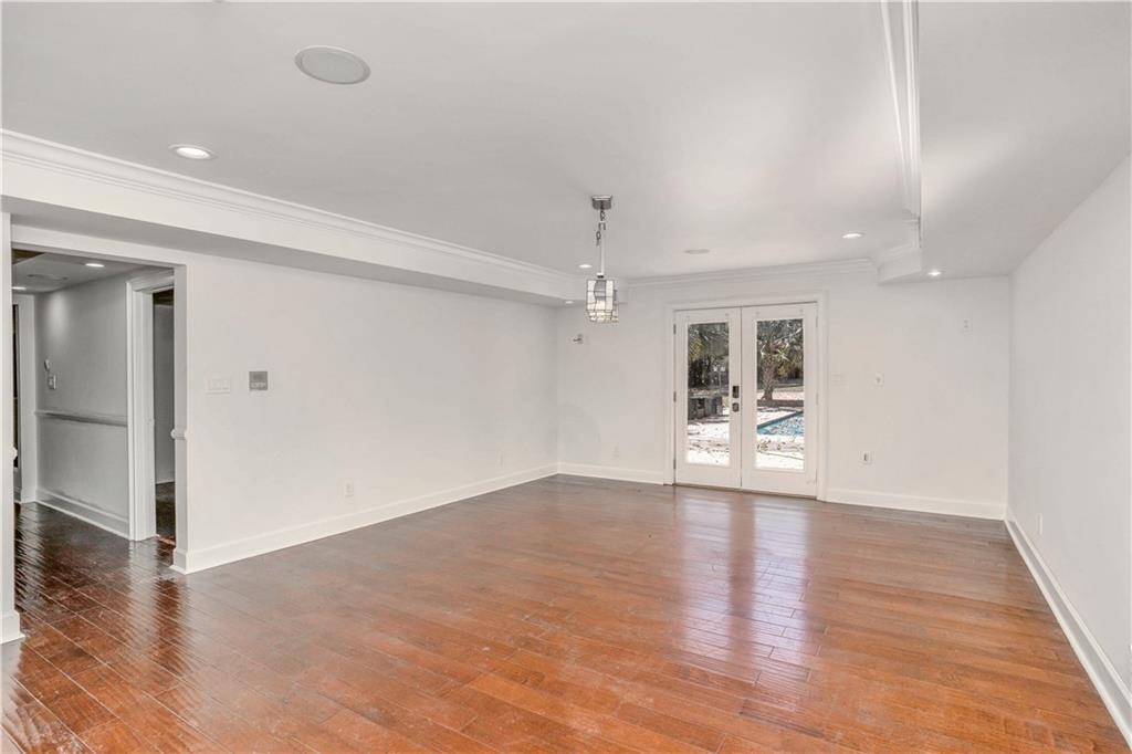 105 Ensley Point Fayetteville, GA 30214 - Photo 28 of 37 wooden floor in an empty room with a window