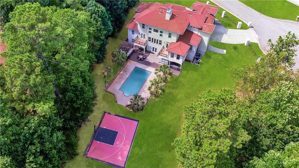105 Ensley Point Fayetteville, GA 30214 - Photo 32 of 37 an aerial view of a house with a yard and pool