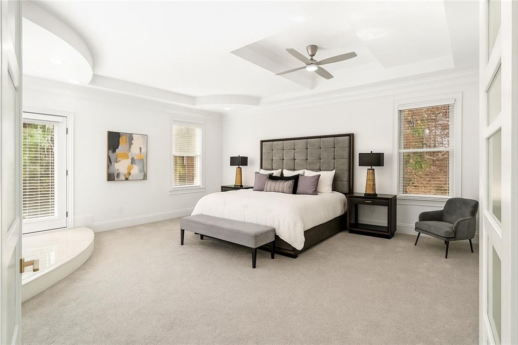 105 Ensley Point Fayetteville, GA 30214 - Photo 4 of 37 a bed room with a bed and a couch