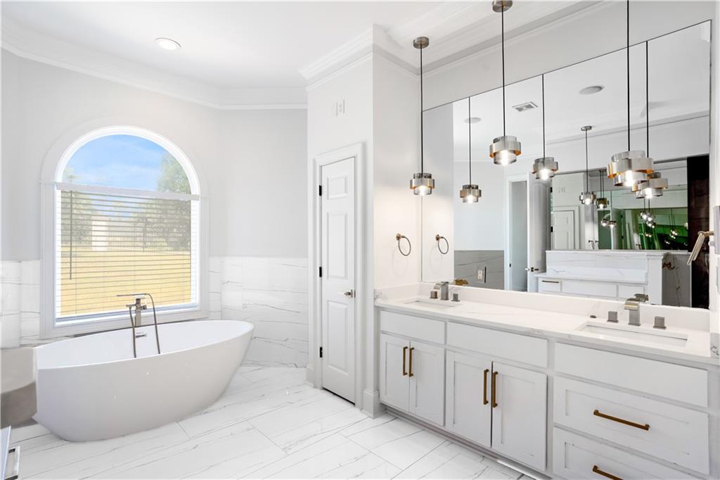 105 Ensley Point Fayetteville, GA 30214 - Photo 8 of 37 a bathroom with a tub sink double vanity granite and shower