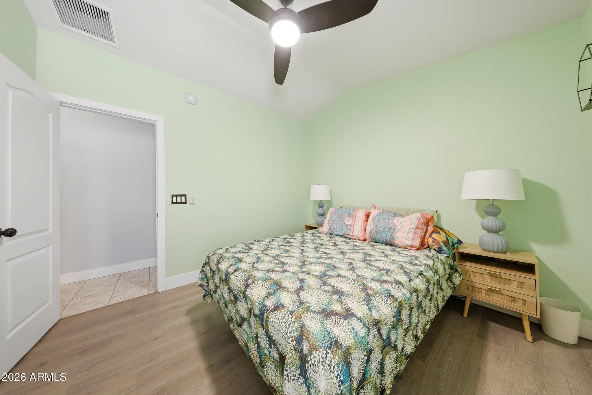 2153 East Kempton Road Chandler, AZ 85225 - Photo 41 of 50 a bedroom with a bed and wooden floor