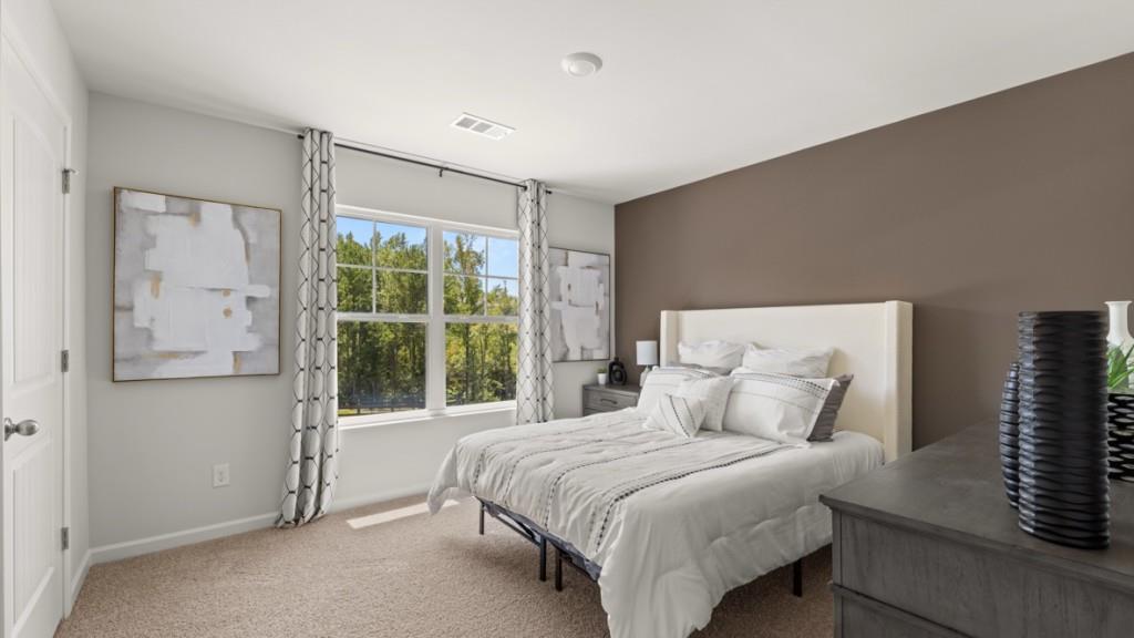 38 Rye Terrace Braselton, GA 30517 - Photo 24 of 33 a bedroom with a large bed and a large window