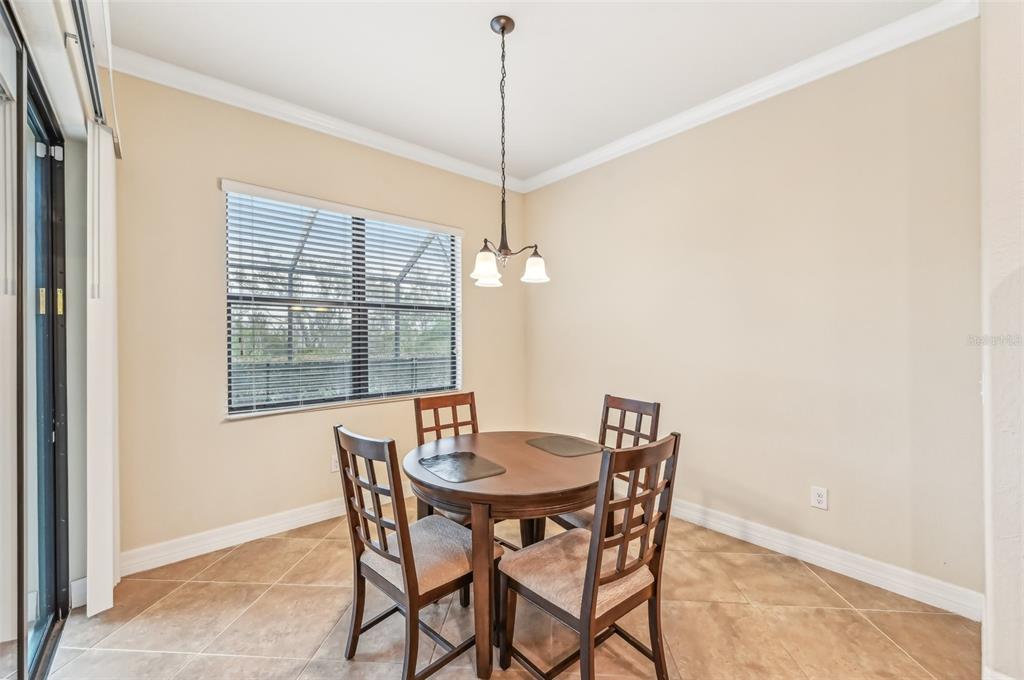 20345 Reale Circle Venice, FL 34293 - Photo 11 of 80 a dining room with furniture and window
