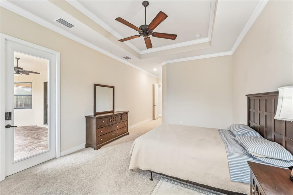 20345 Reale Circle Venice, FL 34293 - Photo 35 of 80 a bedroom with a bed and a ceiling fan