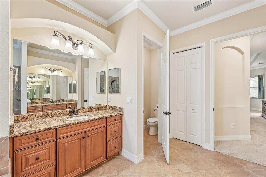 20345 Reale Circle Venice, FL 34293 - Photo 45 of 80 a spacious bathroom with a granite countertop sink mirror and a