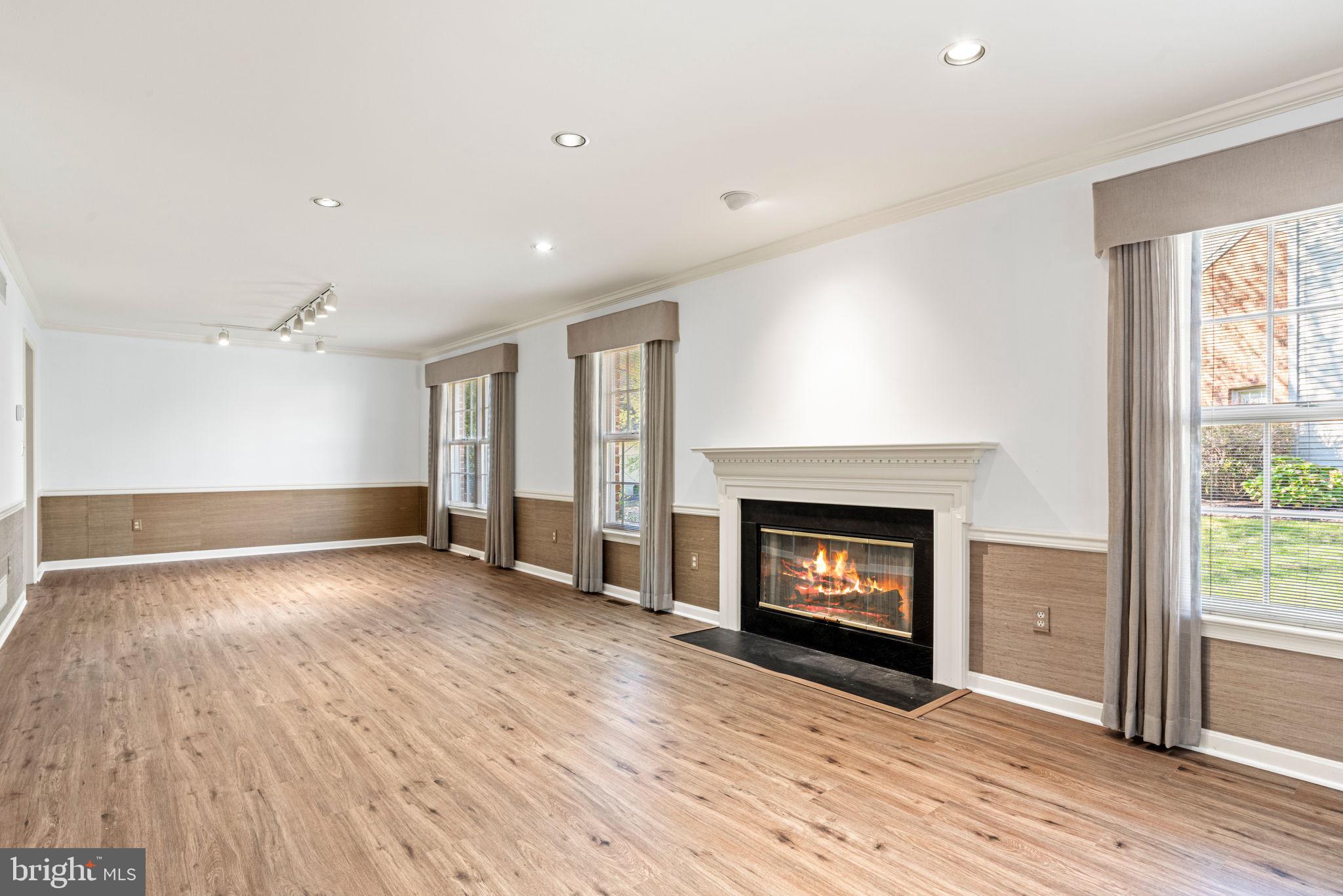 72 Leearden Road Hershey, PA 17033 - Photo 11 of 53 an empty room with wooden floor fireplace and windows