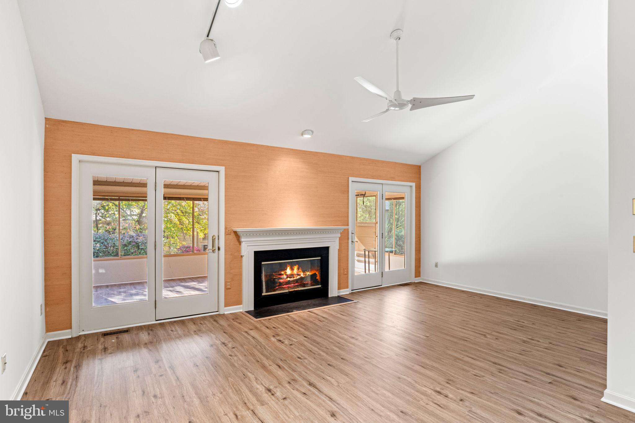 72 Leearden Road Hershey, PA 17033 - Photo 21 of 53 an empty room with wooden floor fireplace cabinet and windows