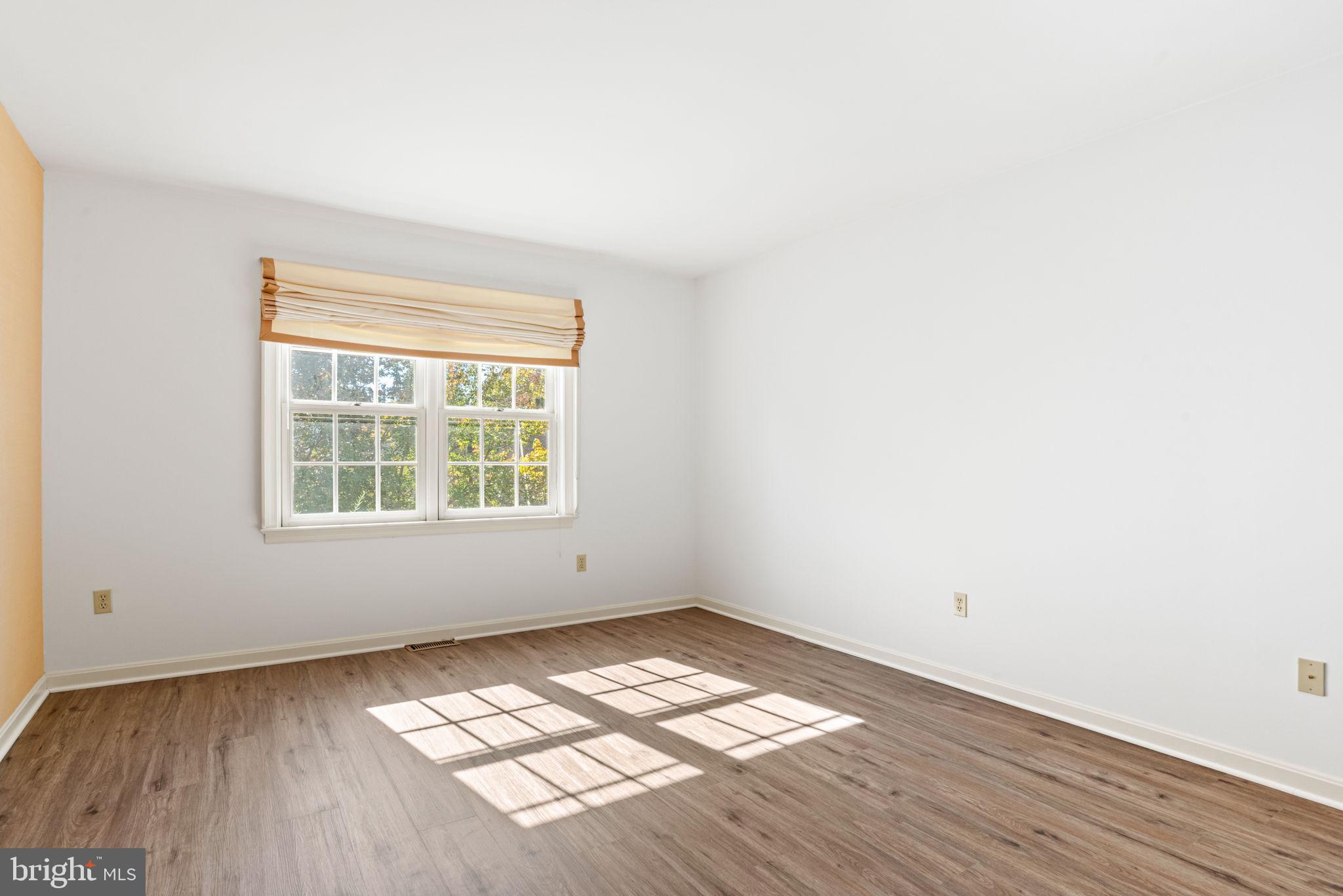72 Leearden Road Hershey, PA 17033 - Photo 41 of 53 an empty room with wooden floor and windows