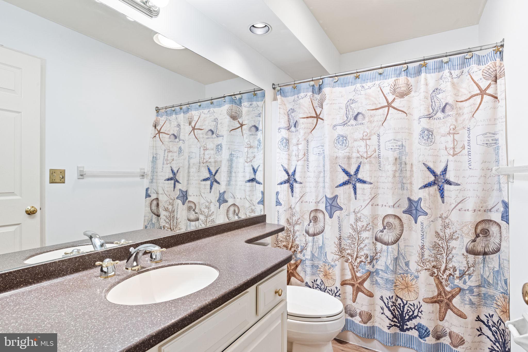 72 Leearden Road Hershey, PA 17033 - Photo 44 of 53 a bathroom with a granite countertop sink a toilet and shower curtain