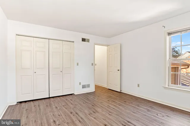 an aerial view of a house with garden space and street view