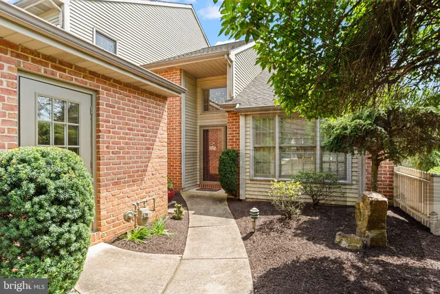 a view of a door with brick walls