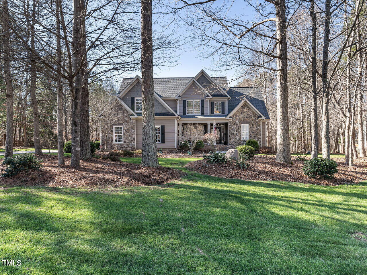 1173 Smith Creek Way Wake Forest, NC 27587 - Photo 1 of 42 a front view of a house with a garden