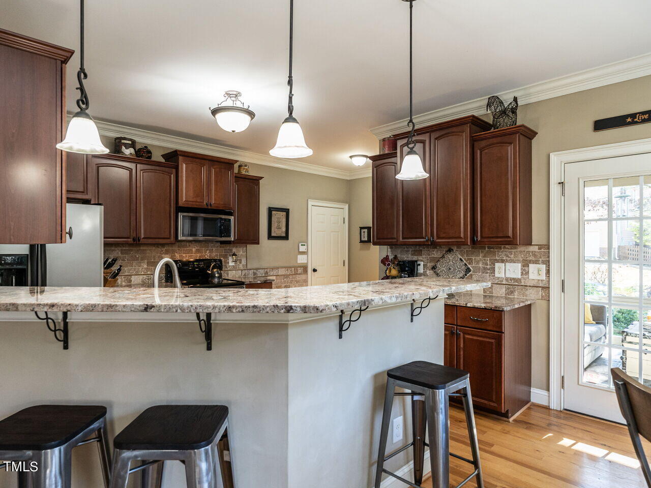 1173 Smith Creek Way Wake Forest, NC 27587 - Photo 13 of 42 a kitchen with a sink cabinets and window