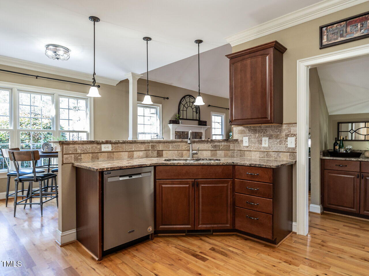 1173 Smith Creek Way Wake Forest, NC 27587 - Photo 16 of 42 a kitchen with kitchen island granite countertop a sink a counter space appliances and cabinets