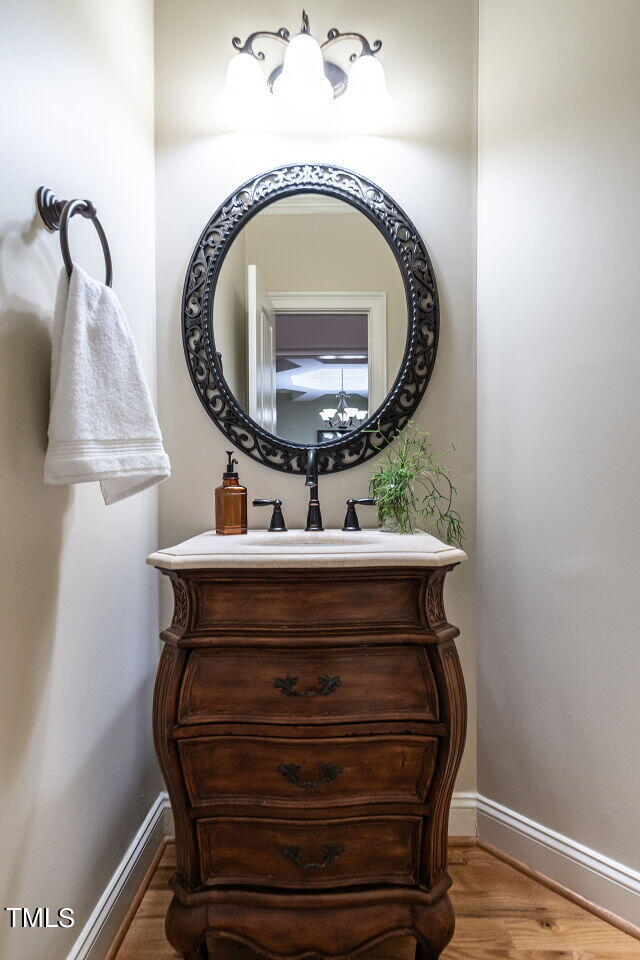 1173 Smith Creek Way Wake Forest, NC 27587 - Photo 20 of 42 a room with a mirror and lamp