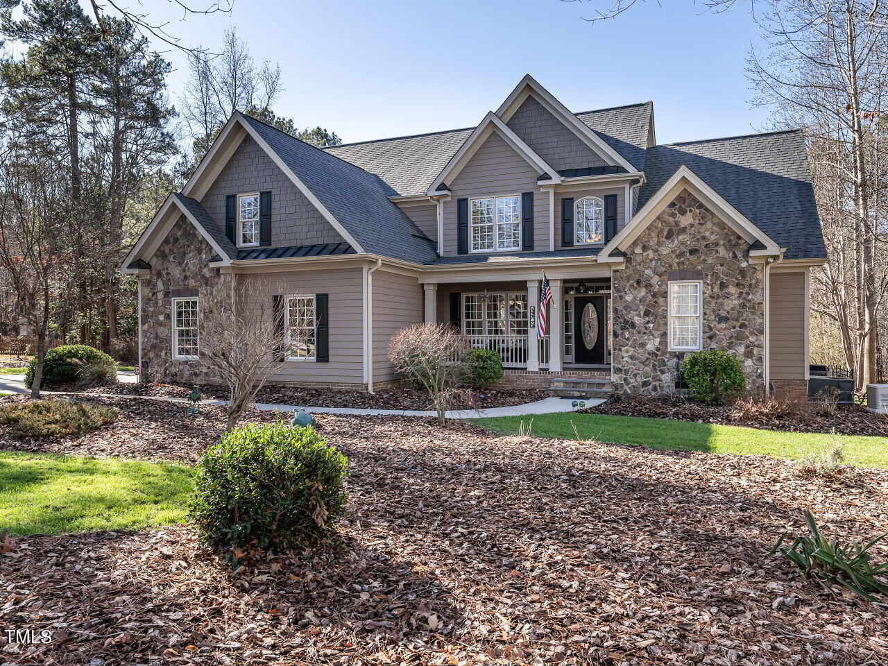 1173 Smith Creek Way Wake Forest, NC 27587 - Photo 2 of 42 a front view of a house with a yard
