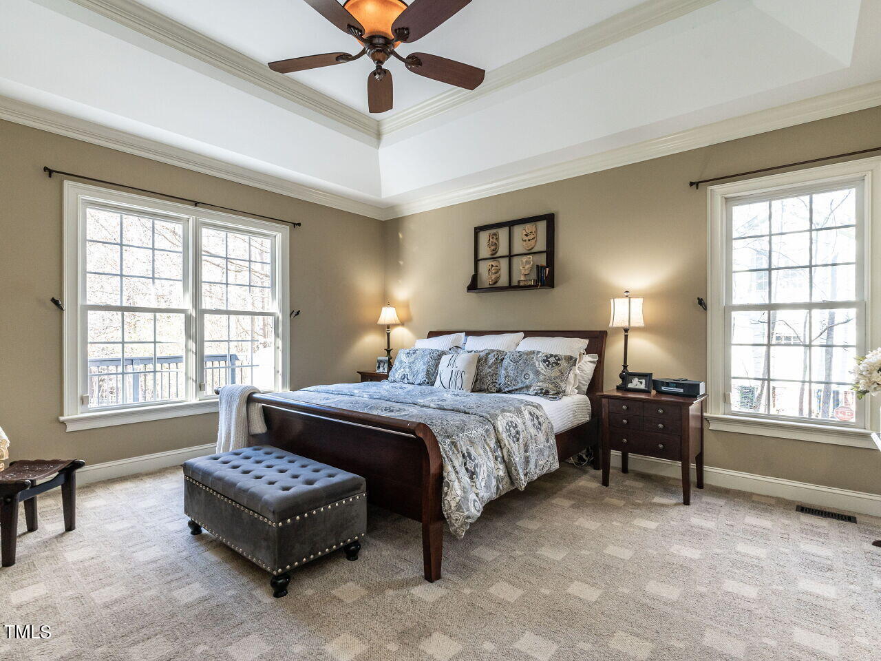 1173 Smith Creek Way Wake Forest, NC 27587 - Photo 21 of 42 a spacious bedroom with a bed a couch and a window