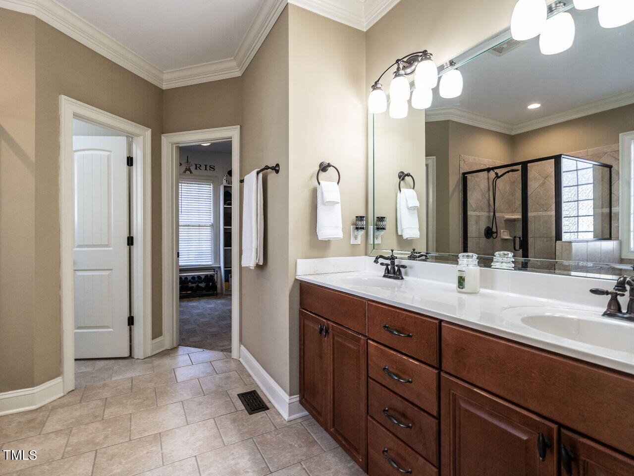 1173 Smith Creek Way Wake Forest, NC 27587 - Photo 22 of 42 a bathroom with a double vanity sink and a mirror