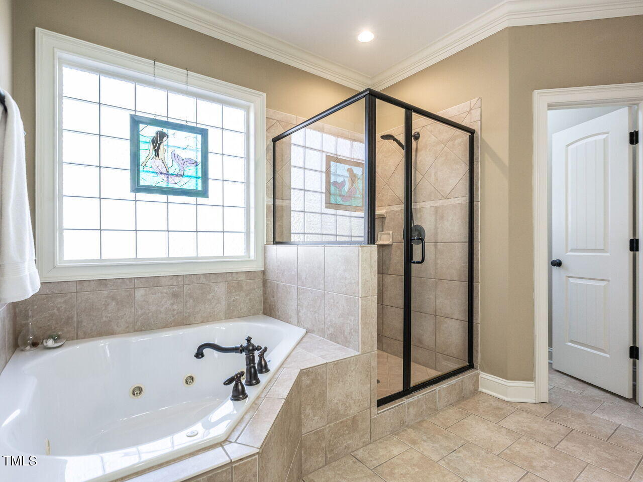 1173 Smith Creek Way Wake Forest, NC 27587 - Photo 23 of 42 a bathroom with a bathtub and a shower