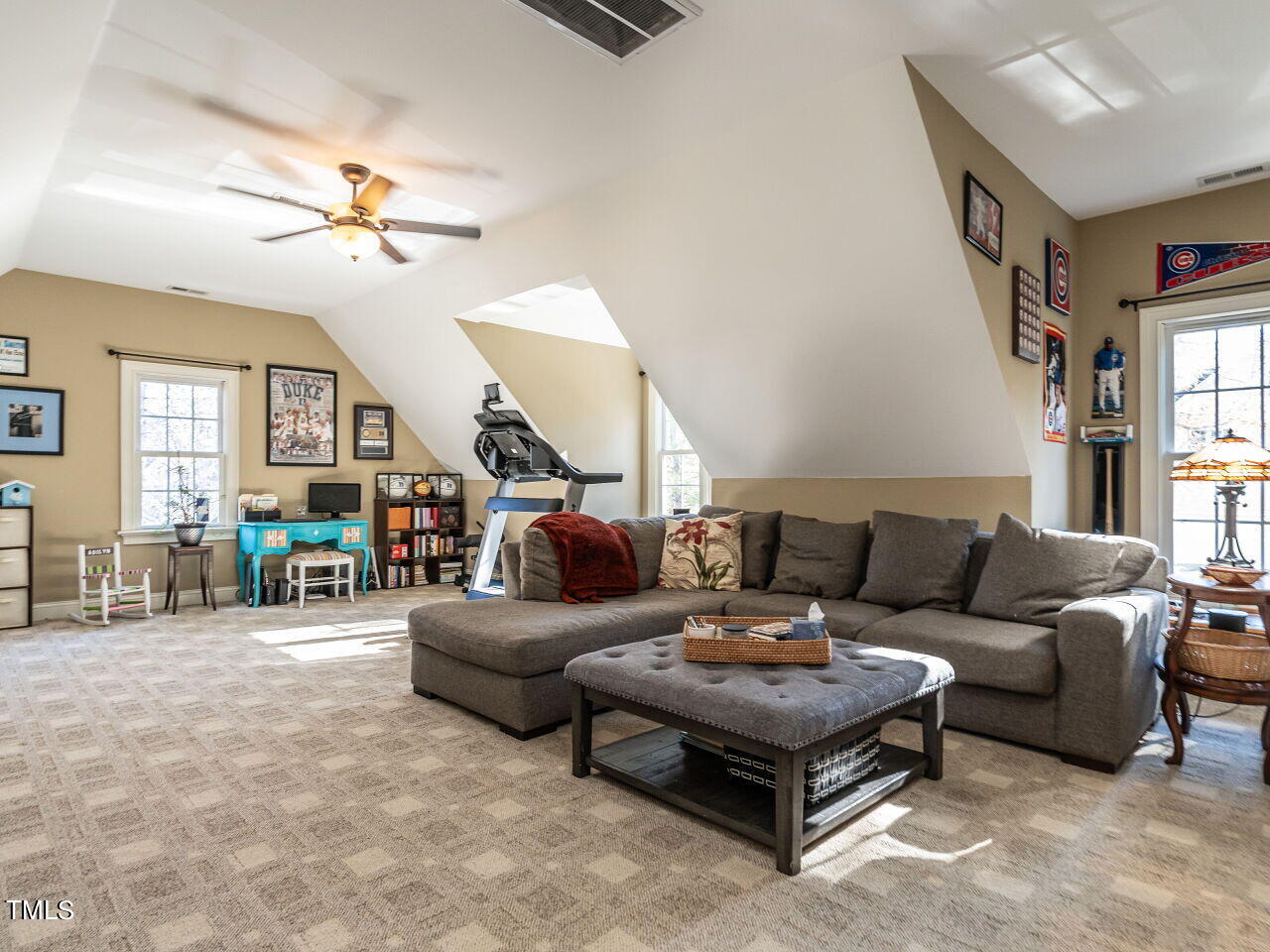 1173 Smith Creek Way Wake Forest, NC 27587 - Photo 29 of 42 a living room with furniture a ceiling fan and a window