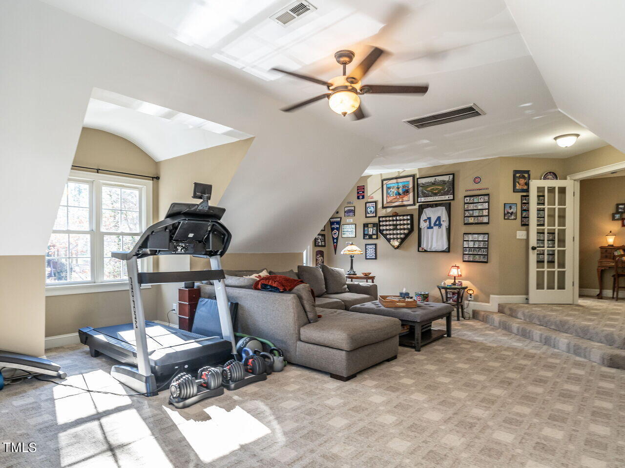 1173 Smith Creek Way Wake Forest, NC 27587 - Photo 30 of 42 a living room with furniture a chandelier and a window