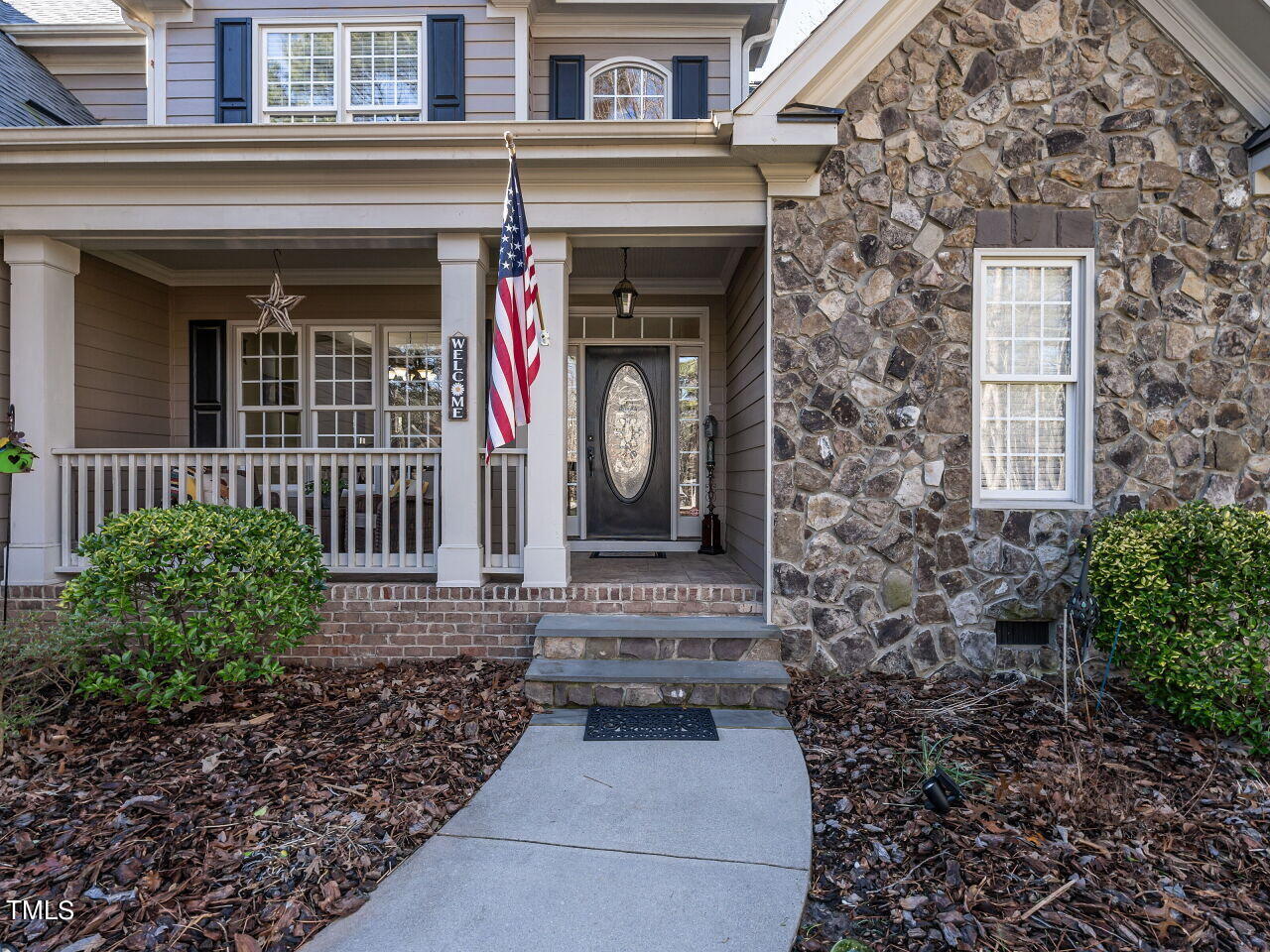 1173 Smith Creek Way Wake Forest, NC 27587 - Photo 3 of 42 a front view of a house with a garden