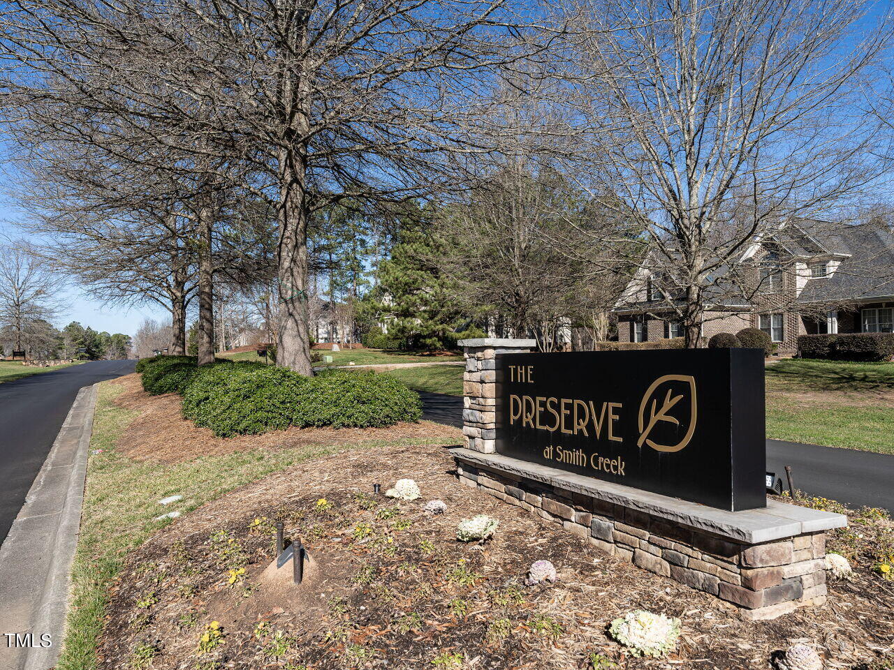 1173 Smith Creek Way Wake Forest, NC 27587 - Photo 39 of 42 a view of a street sign under a large tree