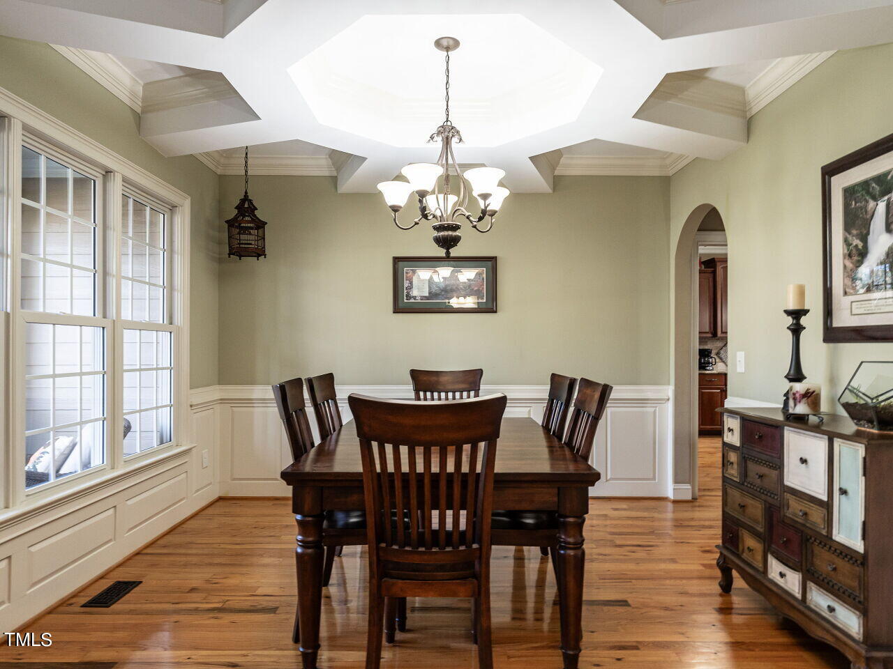 1173 Smith Creek Way Wake Forest, NC 27587 - Photo 5 of 42 a view of a dining room with furniture wooden floor and chandelier