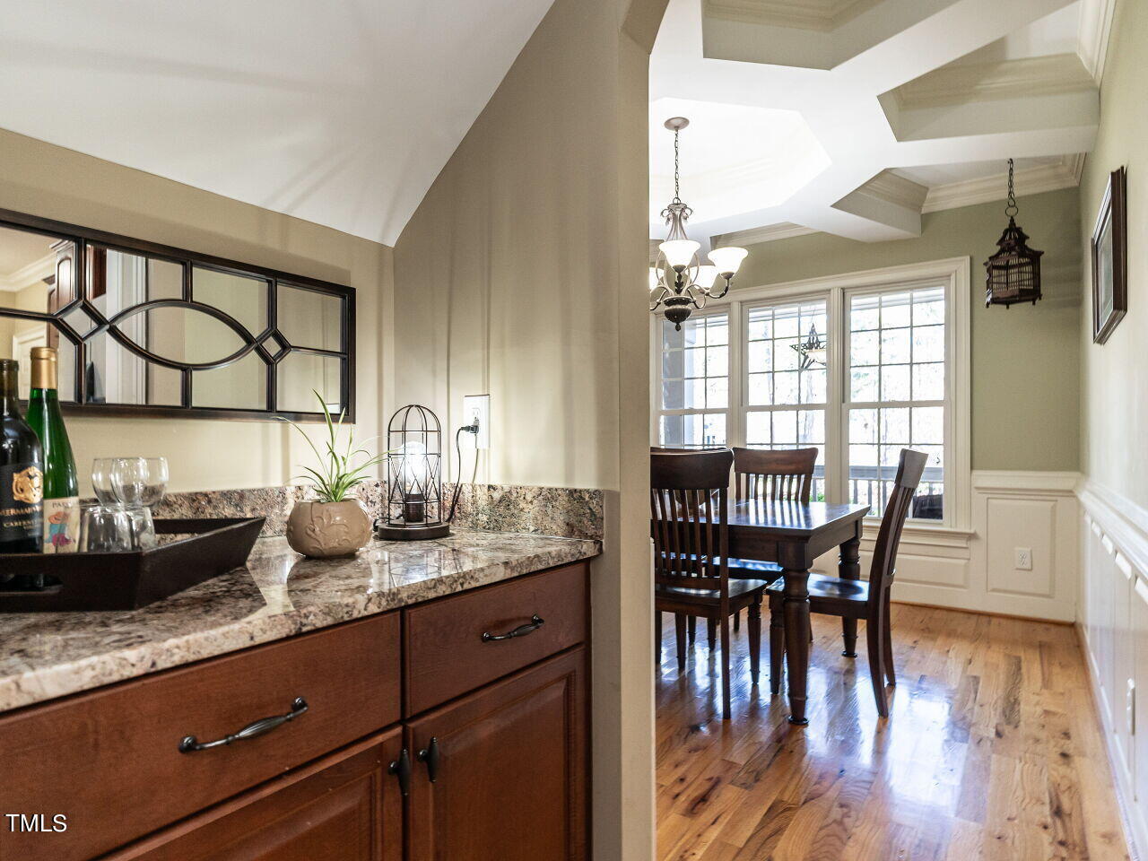 1173 Smith Creek Way Wake Forest, NC 27587 - Photo 7 of 42 a kitchen with sink a table and chairs